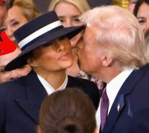 Donald Trump attempts to give Melania a kiss while she wears a wide-brimmed hat