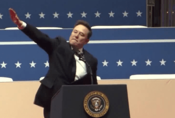 Elon Musk making an awkward arm gesture