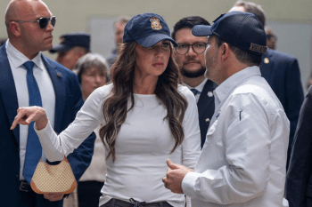Kristi Noem with a Gucci bag hanging off her arm